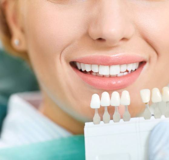 a patient smiling during the teeth whitening process