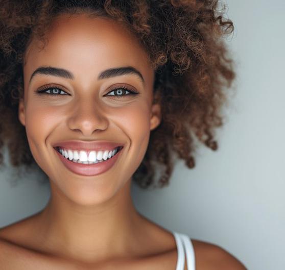 a woman smiling with brighter teeth